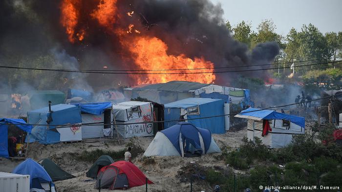 Dozens injured at fight at Calais `Jungle` migrant camp